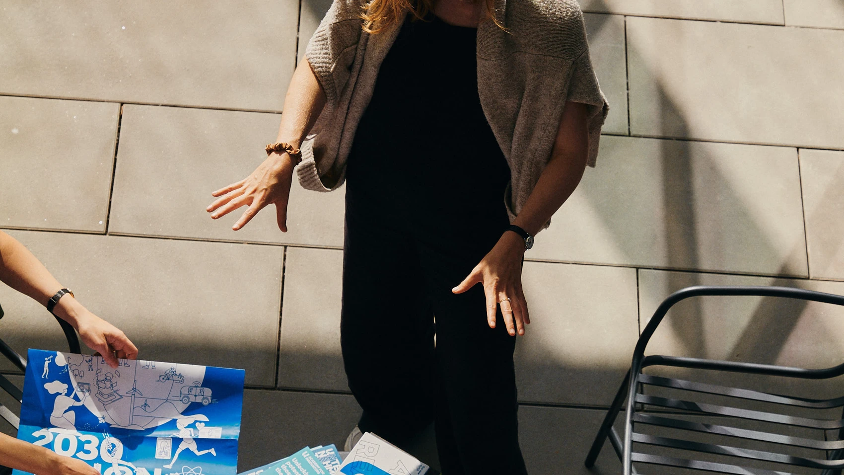 UnternehmerTUM - Munich Urban Colab - Coworkers discussing topics in open space - top view on one student